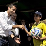 Henrikh Mkhitaryan shaking hands with a fan
