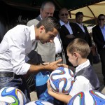 Henrikh Mkhitaryan shaking hands with his fan