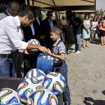 Henrikh Mkhitaryan giving children gifts